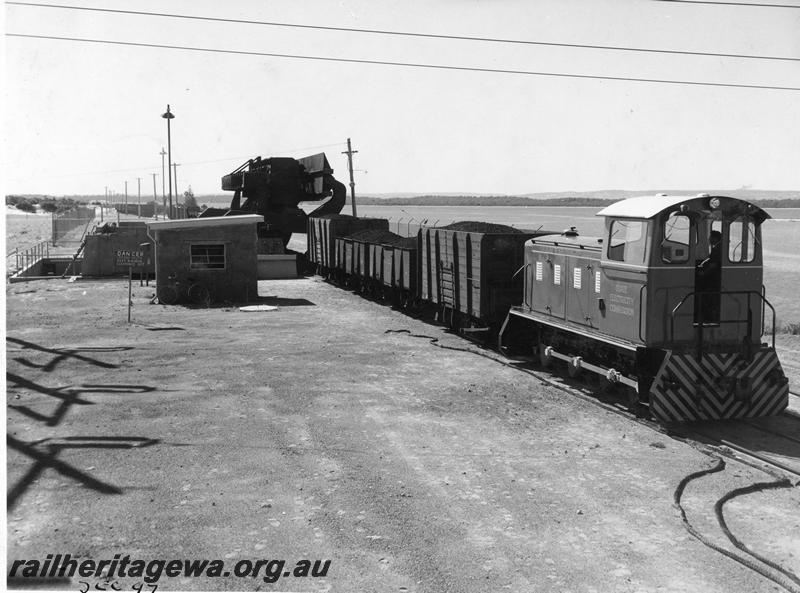 P10166
SEC diesel loco pushing loaded wagon over the wagon tippler, Bunbury Power Station, view looking towards the tippler.
