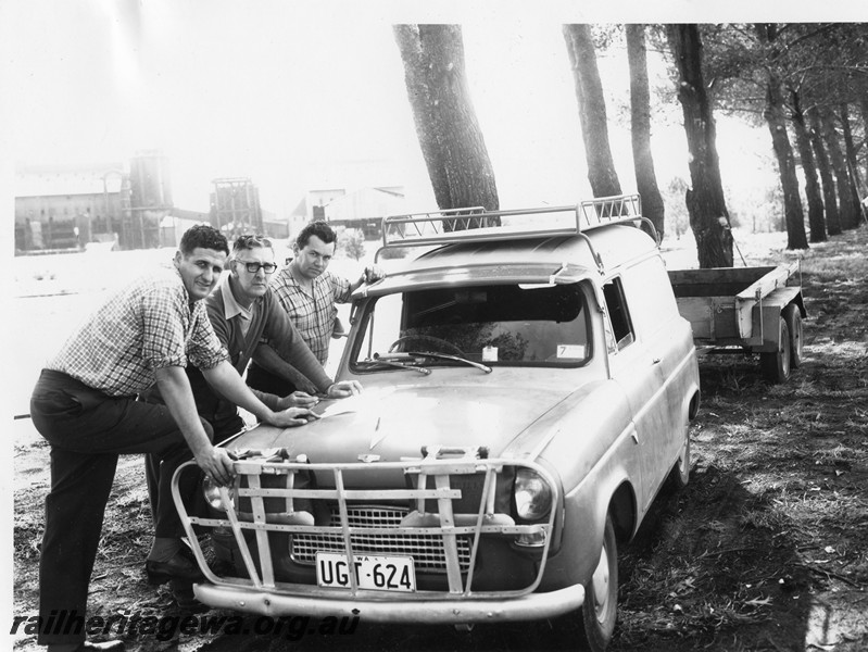 P10214
Rail Transport Museum site, members Noel Zeplin, Edwin Woodland and Otto Walkemeyer checking a plan on the bonnet of a car.
