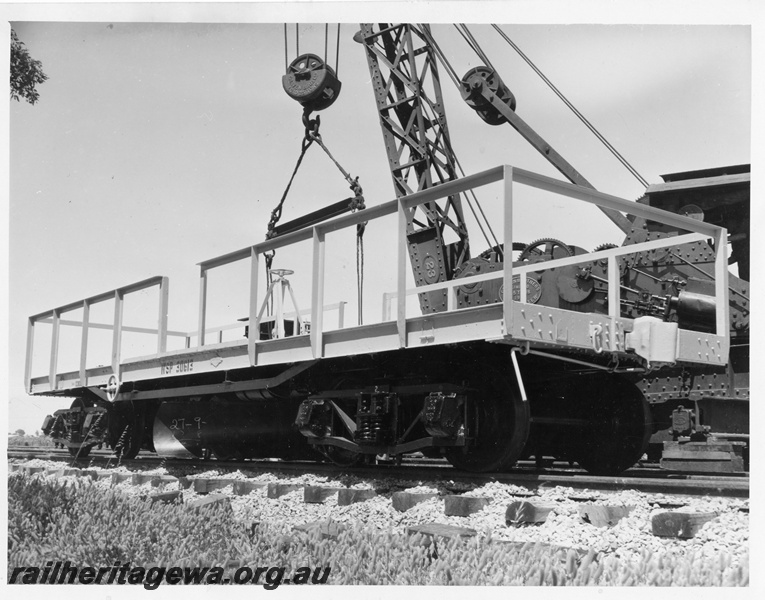 P10243
WSP class 30613 standard gauge ballast plough being lowered onto the track by Cravens breakdown crane No 23, side and end view
