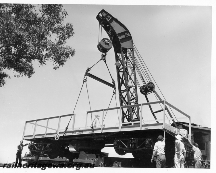 P10244
WSP class 30613 standard gauge ballast plough being lowered onto the track by Cravens breakdown crane No 23, side and end view
