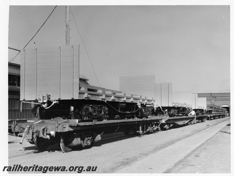 P10247
WSF class standard gauge flat wagons with end bulkheads loaded onto narrow gauge flat wagons, Midland Workshops, view along the wagons
