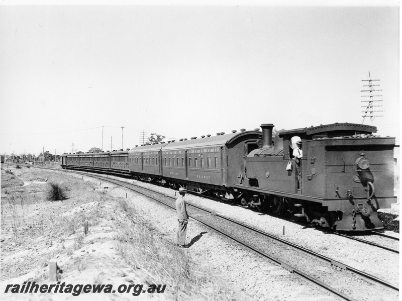 P10264
N Class 199 steam loco hauling the Midland Railway overnight passenger train around the Brady's Curve, Bayswater, en route to Perth, view along the train, ER line, c. 1938
