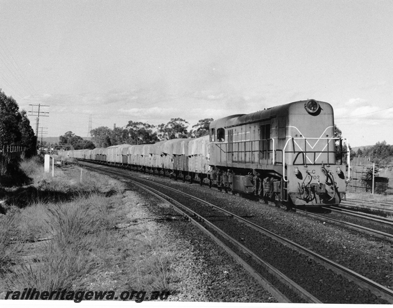 P10319
C class,1702 in the Westrail orange livery with a train of tarpaulined wagons, East Guildford
