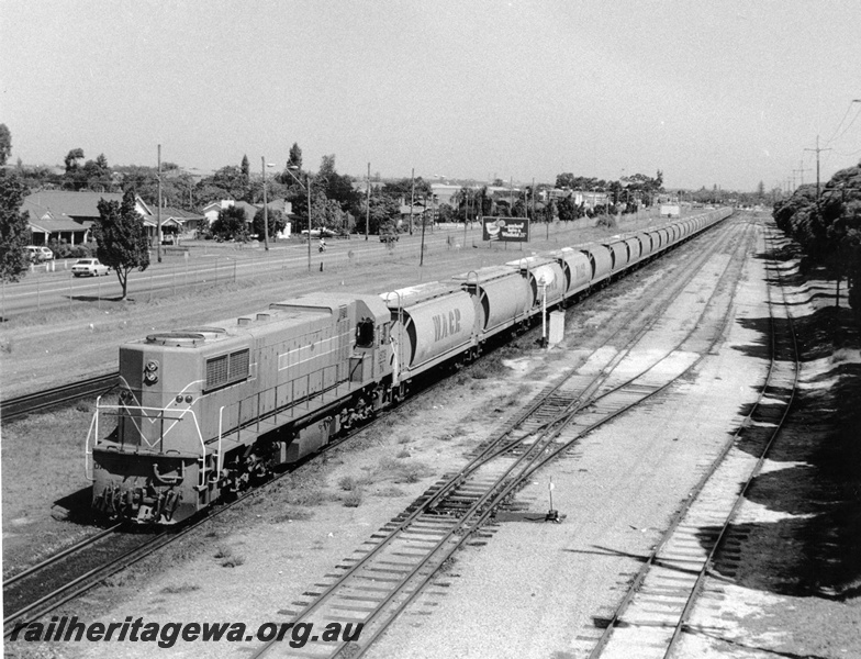 P10328
DA class 1572 in the Westrail orange livery hauling a grain train eastwards through Ashfield, searchlight signal, dual gauge point with a 