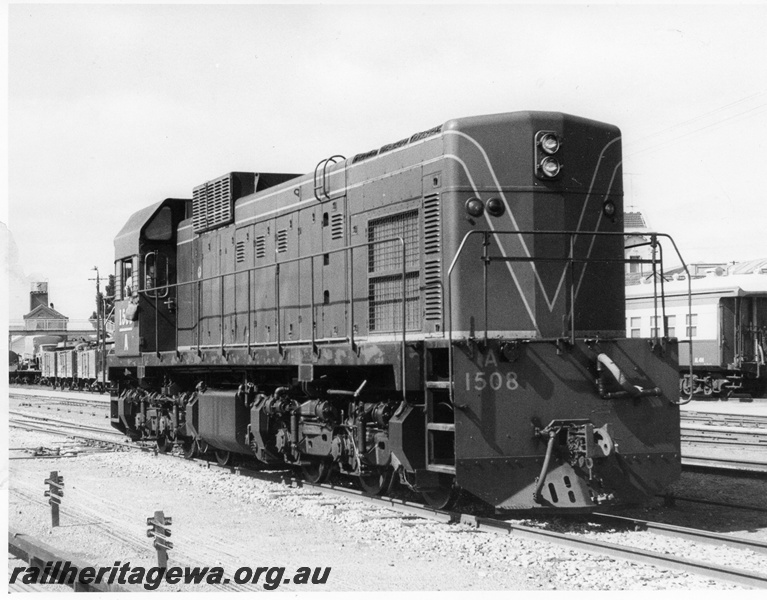 P10360
A class 1508, Green with Red and Yellow stripes, side and long end view, passenger car coupling shown in long end buffer.
