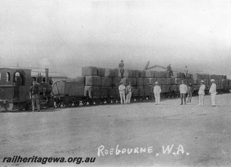 P10432
Roebourne No.1 Orenstein & Koppel steam locomotive with a test load of 170 bales of wool loaded on 4 wheel wagons and 4 wheel water tanker, Roebourne.
