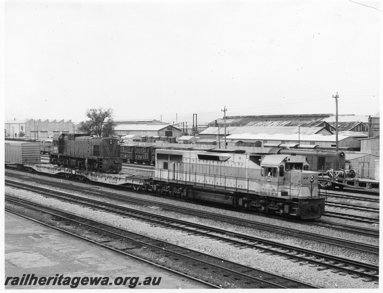 P10434
L class 268 diesel locomotive hauling A class 1509 on WFL class 30059 transporter, side and front view.
