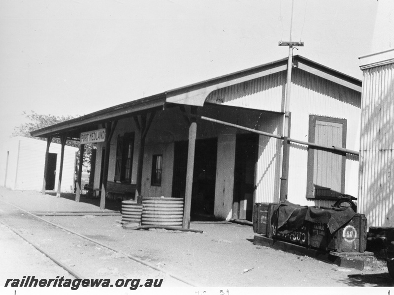 P10436
Station building, trackside view, nameboard, tracks, sheds, Port Hedland, PM line. 
