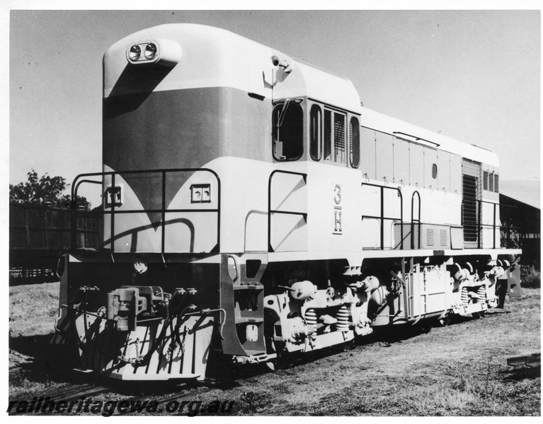 P10440
H class 3 standard gauge diesel locomotive at Midland Workshops. Three quarter front and side view of locomotive.
