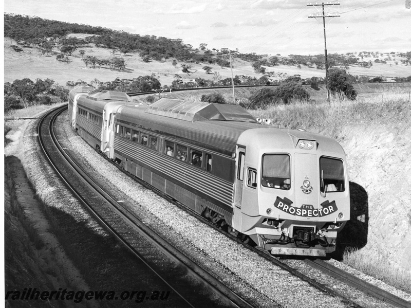 P10453
Prospector railcar set travelling in the Avon Valley towards Avon Yard and about to pass through No. 1 cutting. Front and side view of leading railcar.
