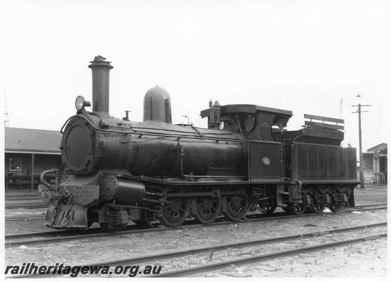 P10465
G class 67 steam locomotive at Fremantle loco depot. Note the extra hungry boards on the tender allowing increased coal capacity.
