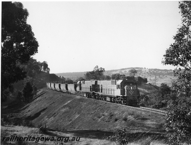 P10469
1 of 6. N class 1874 and 1873 diesel locomotives with 66 loaded XC class bauxite wagons on the Jarrahdale branch.
