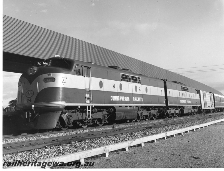 P10478
GM class 24 and 29 Commonwealth Railway diesel locomotives with the Trans Australian at East Perth Terminal/ The van behind the locos was used for the carriage of mail.
