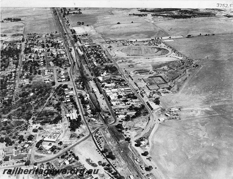 P10501
Station yard, Cunderdin, EGR line, oblique aerial photo looking west, shows pumping station
