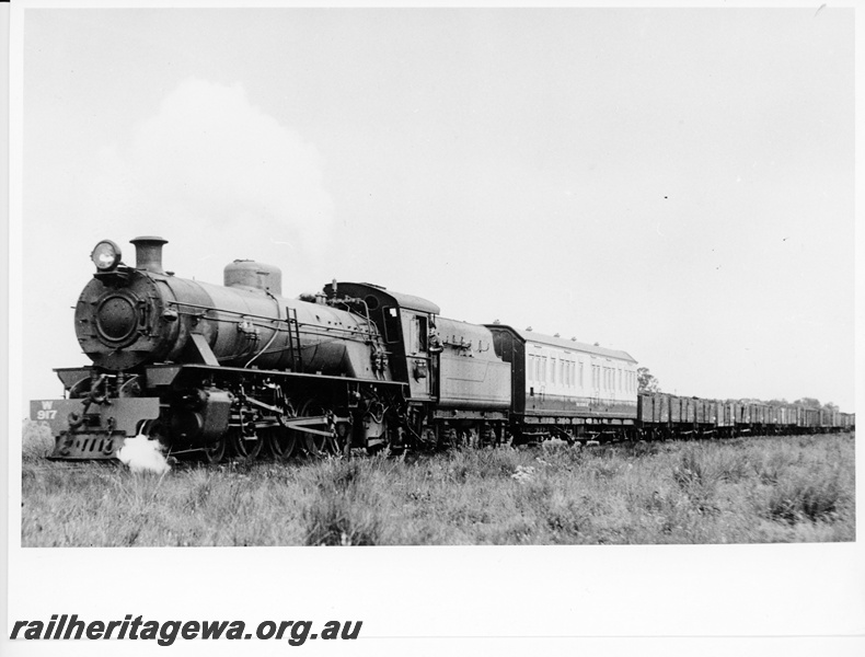 P10543
W class 917 narrow gauge steam locomotive with a goods train. ALT class 88 Track Recorder Car is attached behind the locomotive. Front and side view of locomotive.
