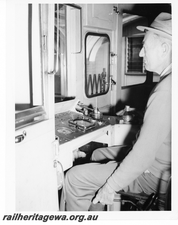 P10548
The drivers controls of an ADX diesel mechanical railcar. The driver's dress is conducive to a clean environment.
