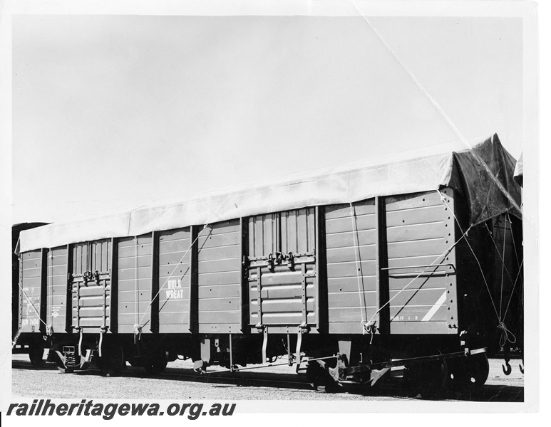 P10564
RCW class 2404? bogie bulk wheat with a tarpaulin covering applied.
