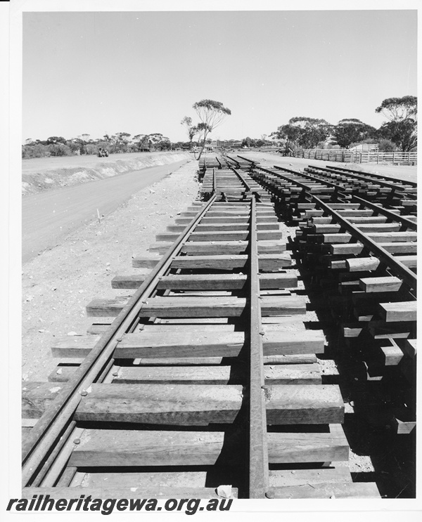 P10594
Stacks of prepared rail track, at Dalwallinu, that had been removed prior to being re-laid on new formation on the left.
