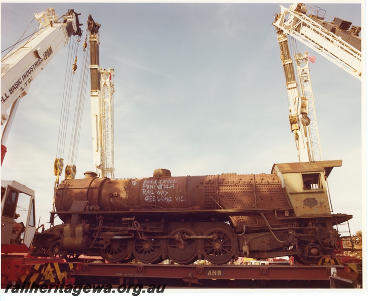 P10635
V class 1209 narrow gauge steam locomotive being loaded onto a Australia National Railway flat top wagon, for railing to Geelong in Victoria, and delivery to Bellarine Peninsula Railway.
