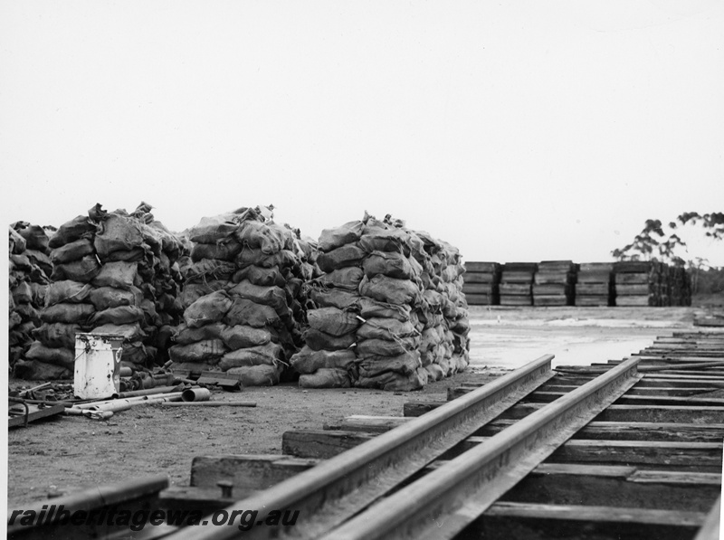 P10661
Standard gauge storage depot, rails, sleepers, hessian sacks, Upper Swan 
