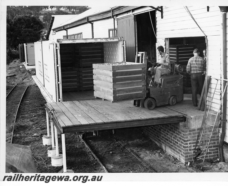 P10798
Loading vegetables into container LFL 01728 on flat bed wagon, forklift with driver, workers, goods shed, Bridgetown, PP line
