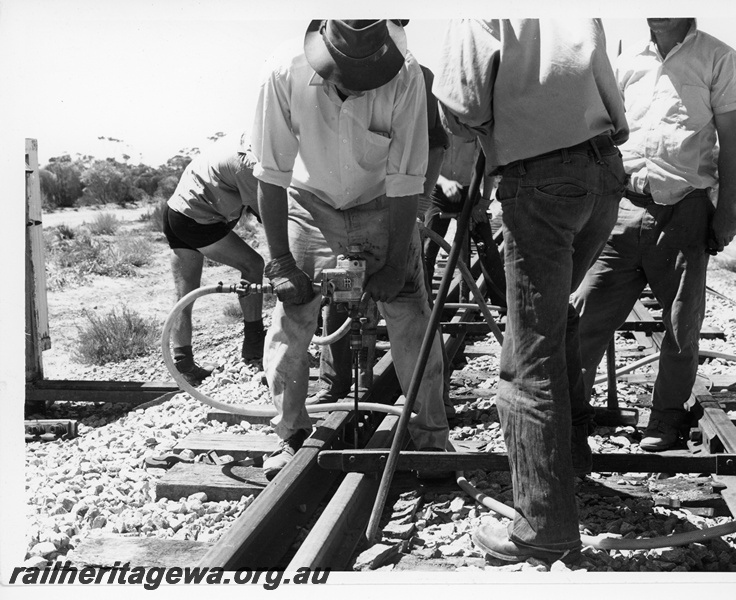 P10800
Track maintenance, workers, Menzies, KL line, close up view at track level
