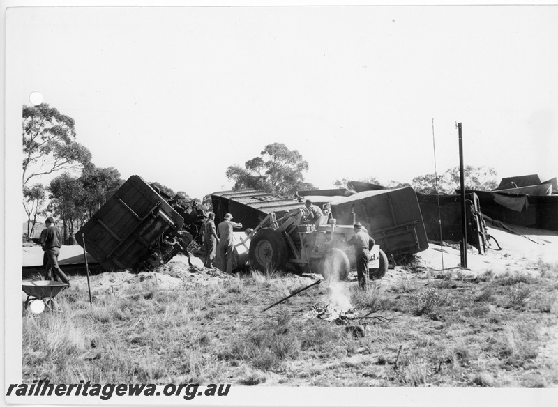 P10867
3 of 4 views of a derailed narrow gauge wheat train, No. 506 Goods near Carani, CM Line GH class wagons off the tracks, front end loader picking up the spilled wheat, date of derailment 11/7/1969
