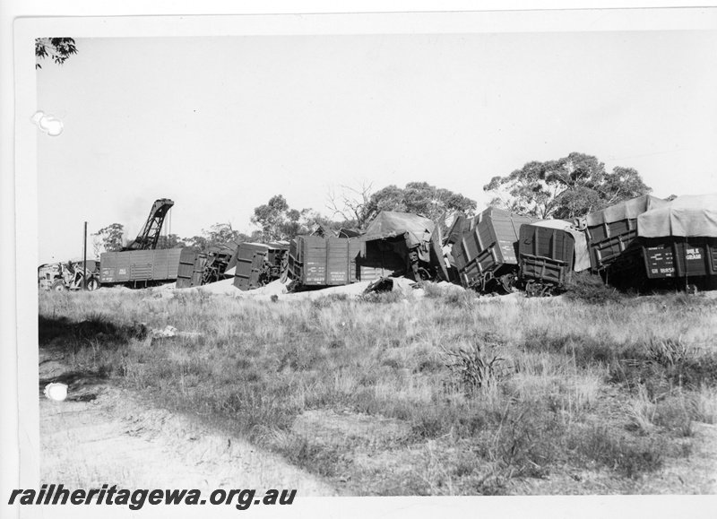 P10868
4 of 4 views of a derailed narrow gauge wheat train, No. 505 Goods near Carani, CM Line, GM class and GH class wagons off the tracks including GH class 18858,  GH class 18710, GH class 18647, 25 ton breakdown crane, No.23 in attendance, date of derailment 11/7/1969
