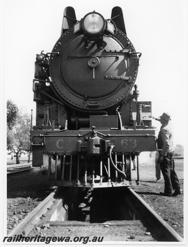 P10890
Commonwealth Railways (CR) C class 63 steam locomotive hauling a eastbound passenger train being serviced at Zanthus. See P10889.
