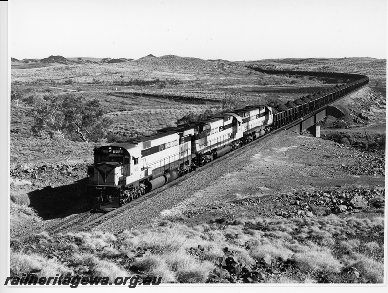 P10911
Cliffs Robe River (CRRIA) M636 class 9410, C630 class 9418, 9420 (ex Chesapeake & Ohio Railroad C630 class locomotive numbers 2101, 2103) at Millar Creek. 
