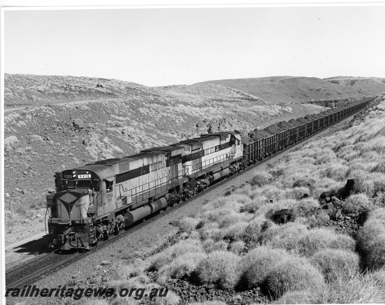 P10916
Cliffs Robe River M-636 class 9416 diesel locomotive and ex Chesapeake & Ohio M-636 class (2103) 9420 hauling a loaded iron ore train enroute to Cape Wickham port.
