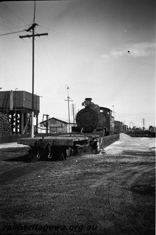 P11021
MRWA D class 19, 4 wheel flat wagon ahead of the loco, water tower, water column, Midland
