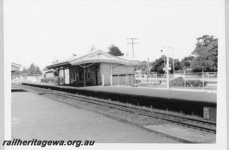 P11038
Station building, Karrakatta, view across tracks to main building on the 