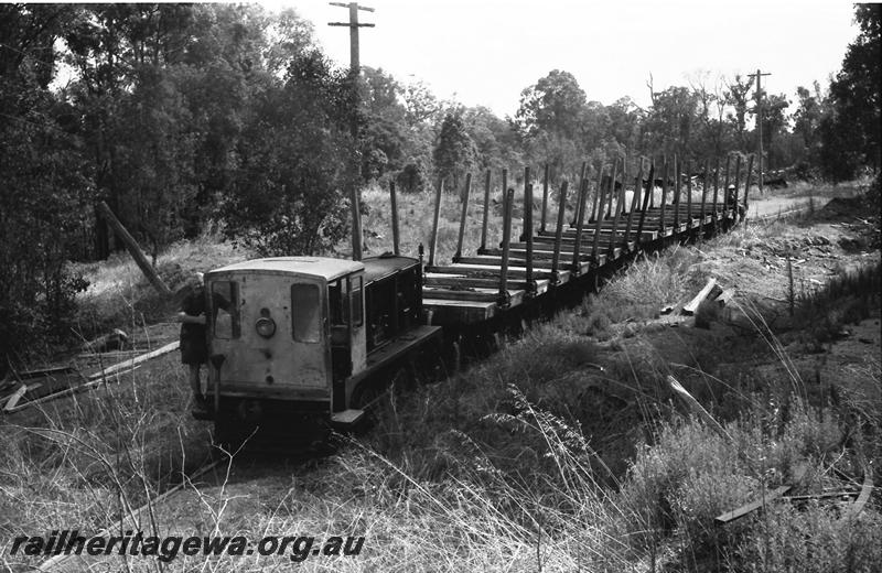 P11121
Nannup mill diesel loco hauling two bogie flat timber wagons, end and side view of the loco.
