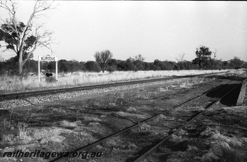 P11124
Nameboard, Murdong, GSR line, view across siding.
