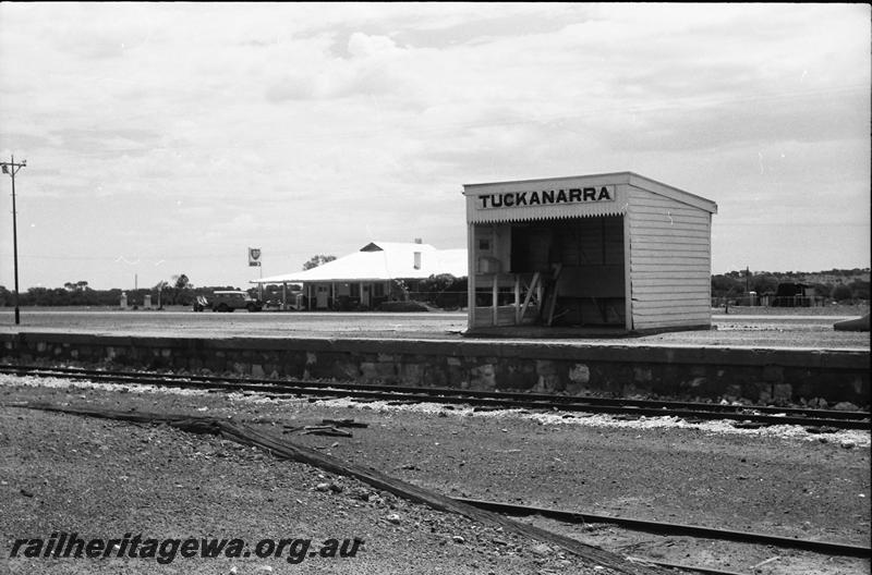 P11152
Station shelter shed, stone (masonry) faced platform Tuckanarra, NR line, trackside view 
