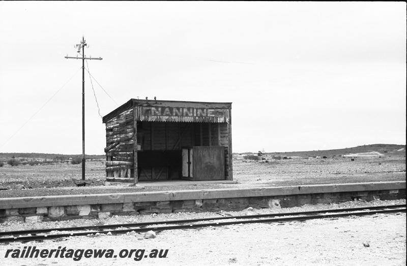 P11155
Station shelter shed, stone (masonry) faced platform, Nannine, NR line, trackside view 
