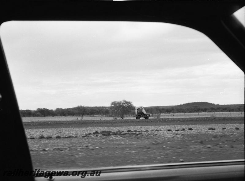 P11157
Motorized gangers trolley taken between Nannine and Meekatharra, NR line, photo taken from car window
