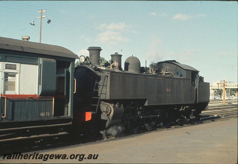 P11281
DD class 593, empty passenger stock, water column, workshops footbridge in background, loop line, Midland Junction. ER line.
