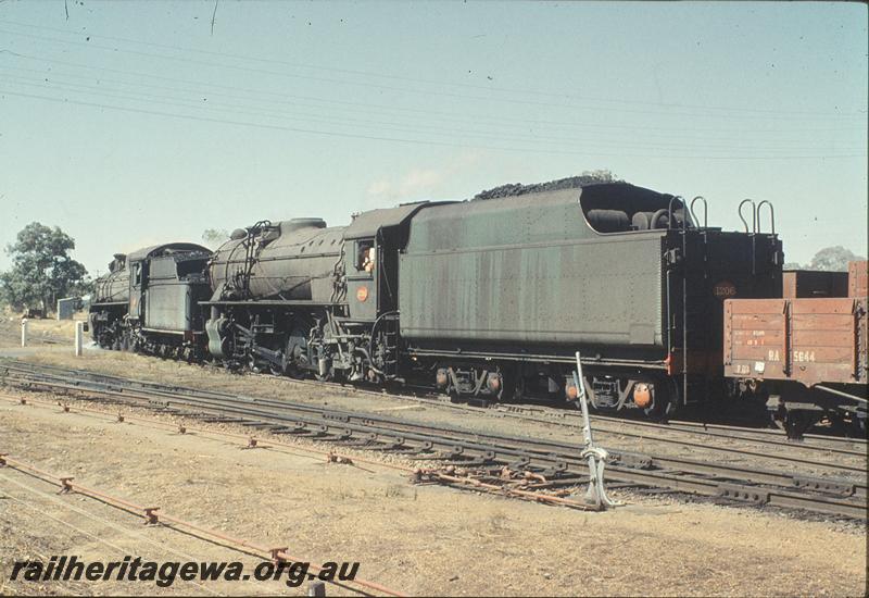 P11304
P class 503, V class 1206  heading a goods train, leading wagon is RA class 5644,  point lever and point rodding in foreground, south end of Brookton. GSR line.
