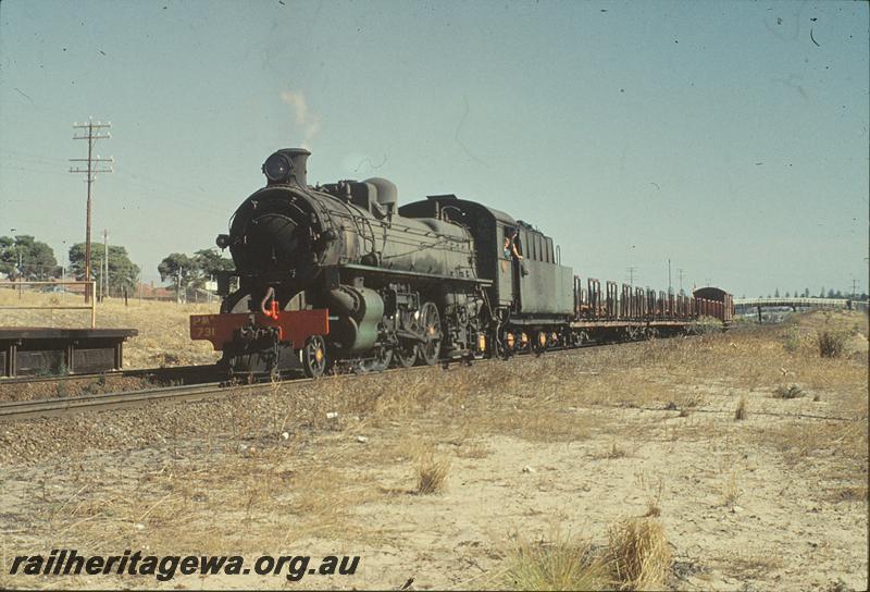 P11374
PMR class 731, Up goods, empty car wagons, overbridge in background, Grant St. ER line.
