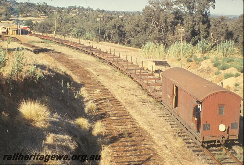 P11387
F class 43, pushing work train, old up line dismantled, station building, platform, Swan View. ER line.
