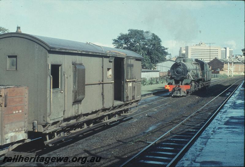 P11573
W class 919, East Perth shunter, following goods train out of yard. ER line.
