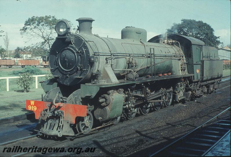 P11574
W class 919, East Perth shunter, following goods train out of yard. ER line.
