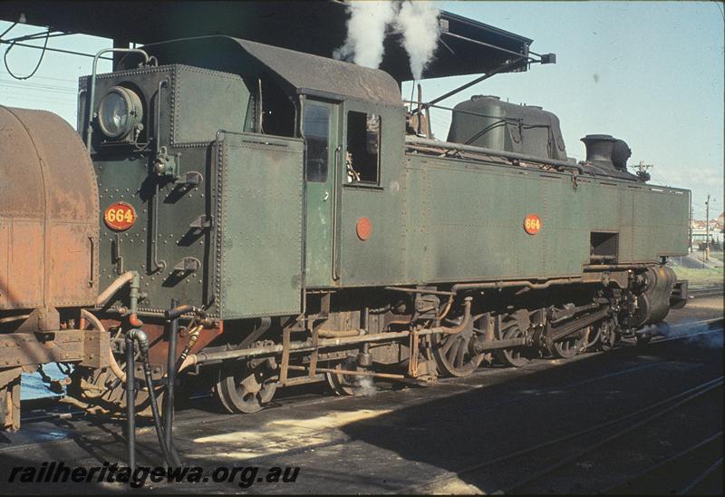 P11606
UT class 664, JX class diesel fuel tanker, refuelling at diesel fuelling facility, East Perth loco shed. ER line.
