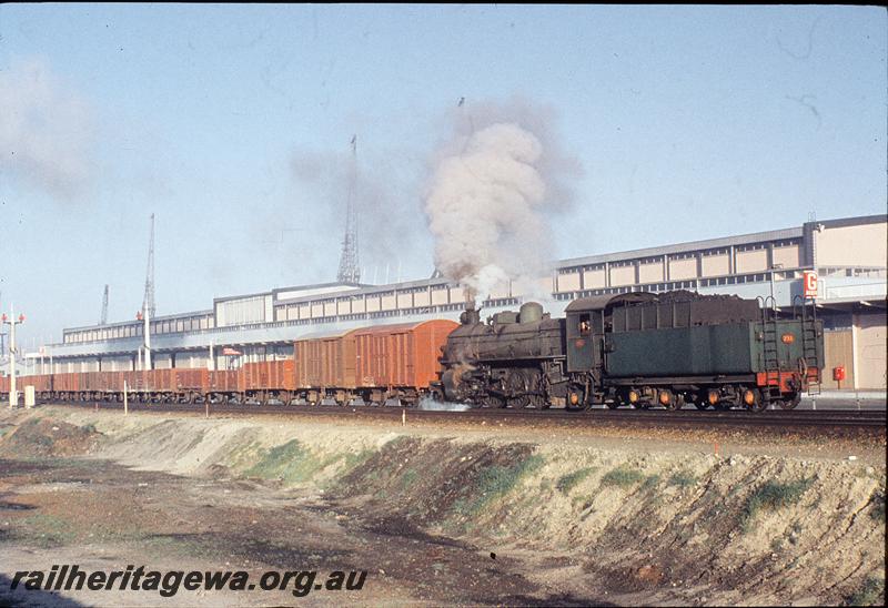 P11631
PMR class 731, tender first on down goods, passenger terminal in background, departing on goods main, Fremantle. ER line.
