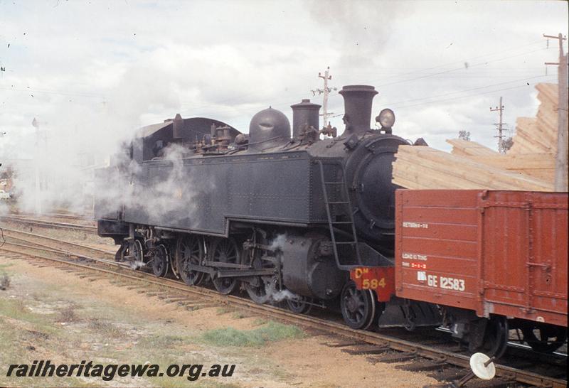 P11682
DM class 584, GE class 12583 recently painted, load of light coloured timber, shunting timber, Kewdale yard.
