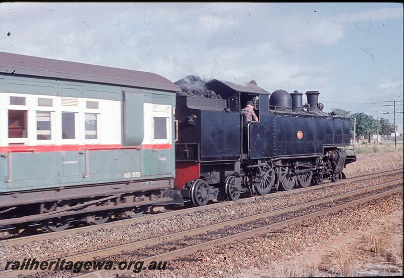 P11765
DD class 597, AS class 375 in the green and white livery with red stripe suburban carriage with brake compartment, near Victoria Park. SWR line.
