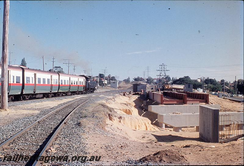 P11774
DD class 599, suburban passenger, new overbridge under construction, Rivervale. SWR line.
