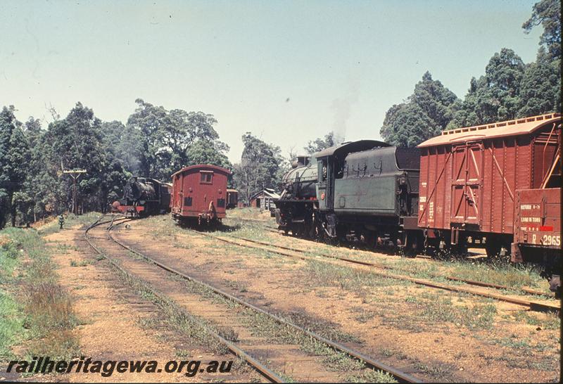 P11812
W class 932, shunting, W class 927 up goods,DC class 2260_ coupled to the loco, R class 2965 on the adjacent track, loco shed in background, Pemberton. PP line.
